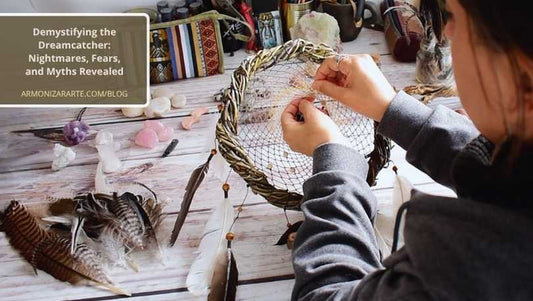 Artisan hands weaving an authentic dreamcatcher with hand-seasoned willow wood branches, cruelty-free feathers, and genuine crystals on a clean workspace.