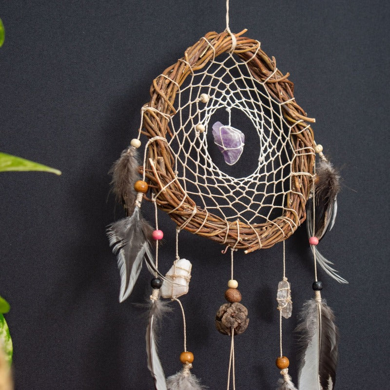 The complete dreamcatcher in its natural decorative setting, showcasing its beauty and intricate design