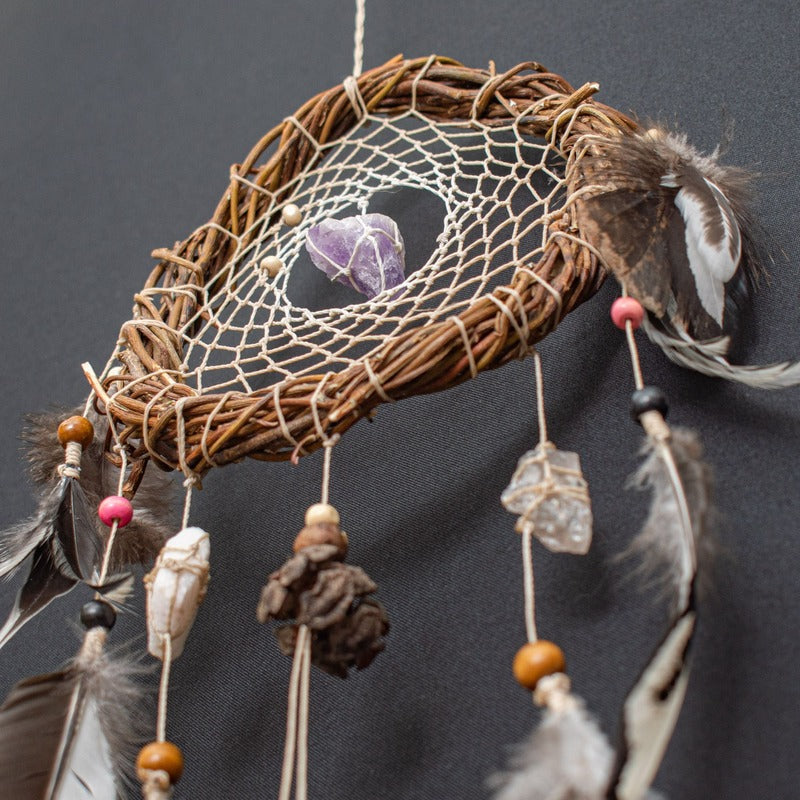 Boho-style white dreamcatcher featuring natural crystals, perfect for unique gifts and home decoration.