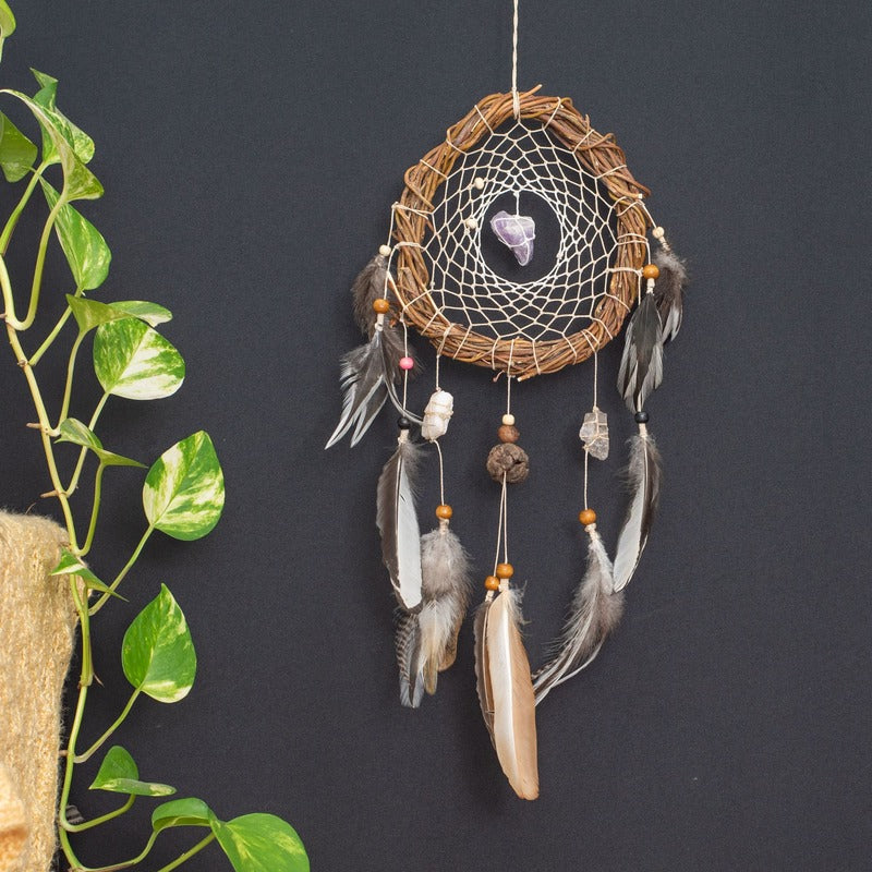 Stunning white dreamcatcher with natural crystals, ideal for energy balance and boho-inspired spaces.
