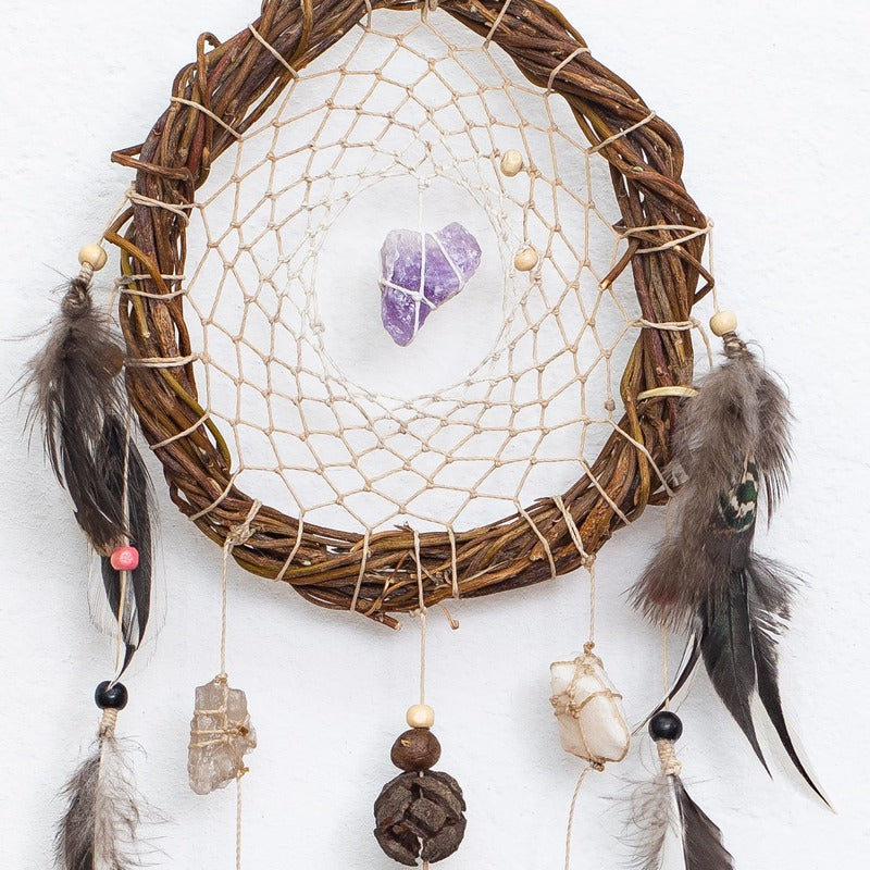 Dreamcatcher in white tones with authentic natural crystals for spiritual cleansing and meaningful gifts.