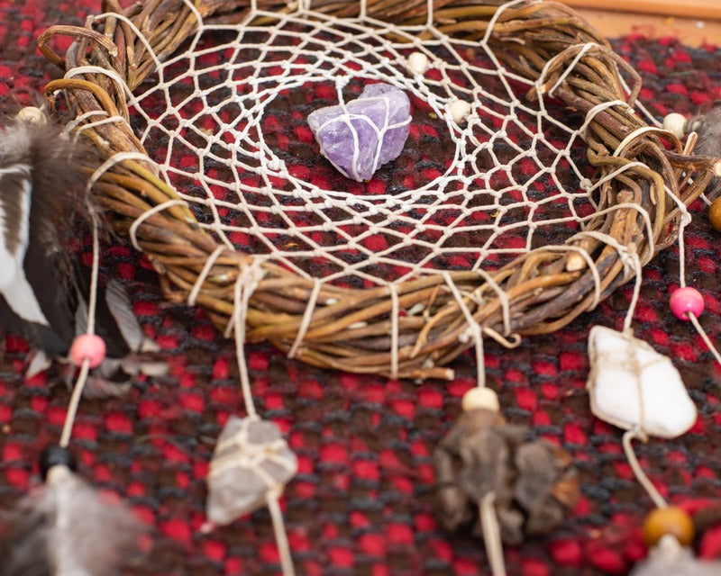 Handmade white dreamcatcher with natural crystals, a thoughtful gift for those seeking serenity and beauty.





