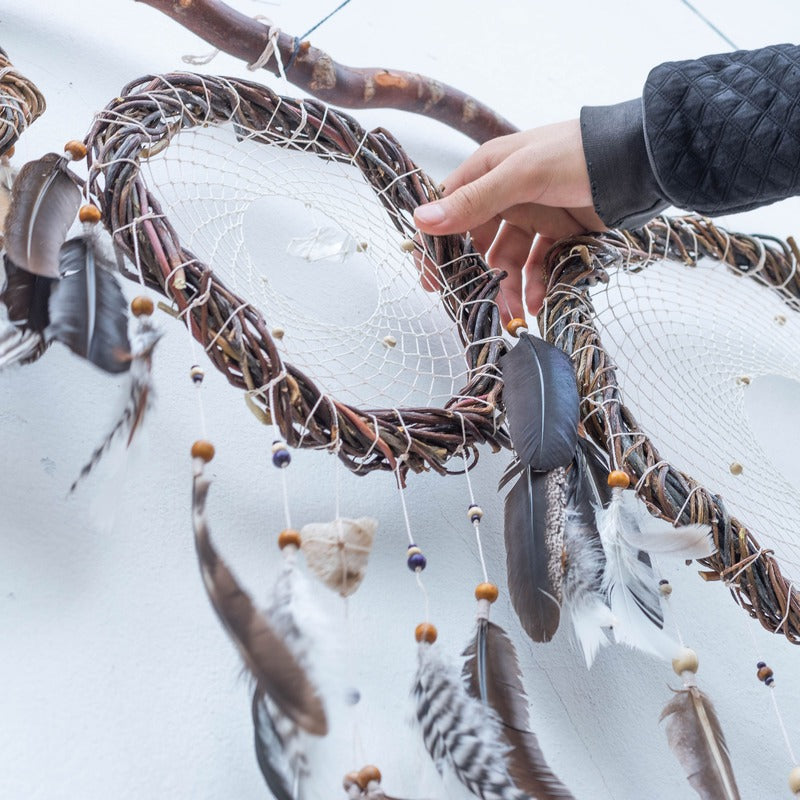 Spiritual home decor featuring white dreamcatchers with quartz