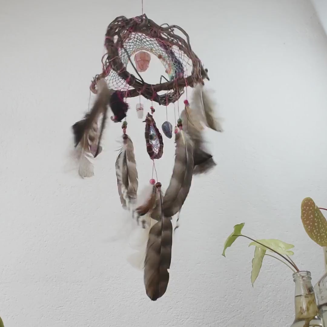 Hanging feathers with heal stones Healing energy